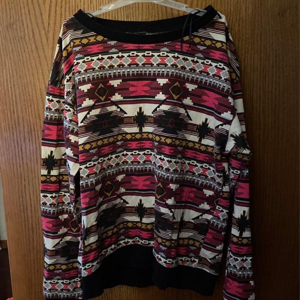 Super cute and colorful patterned light sweater. Perfect for spring and fall.